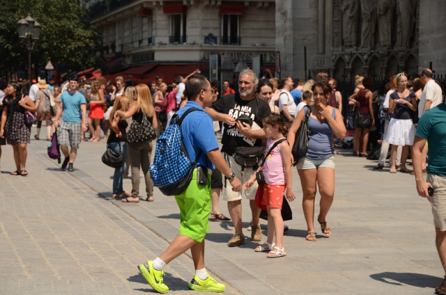 Tourist walking into the Cathedral of Notre Dame de Paris
